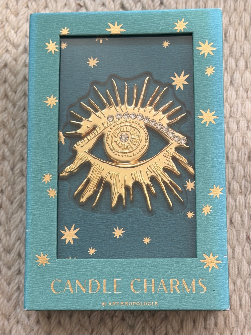 Gold Eye Candle Charm from Anthropologie